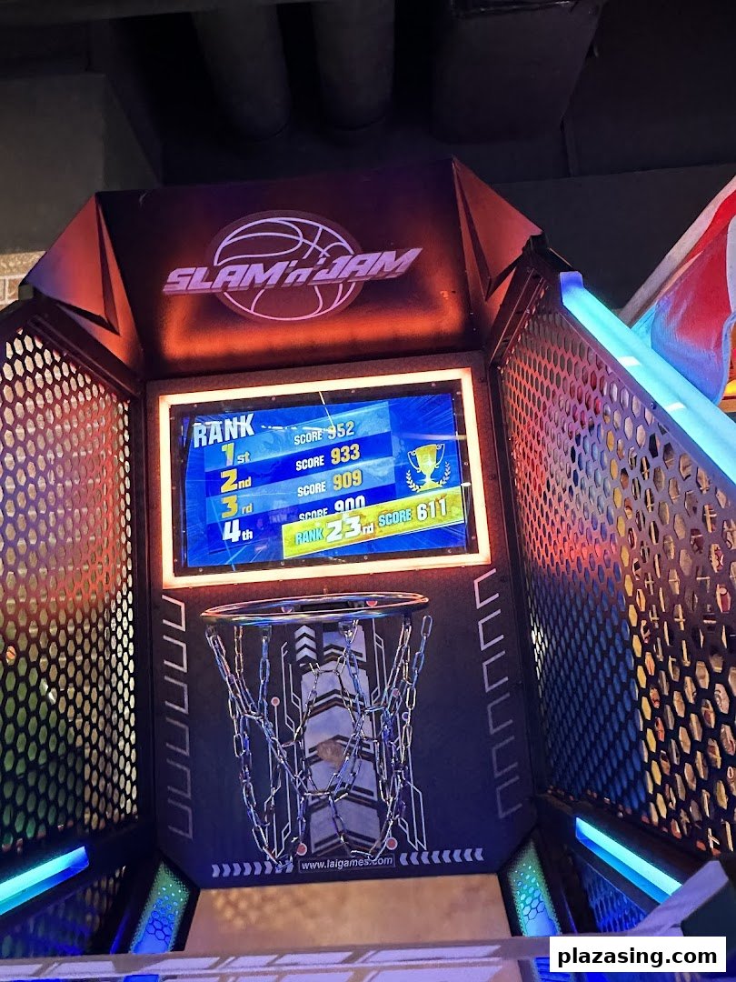 A vibrant basketball arcade game, 'Slam 'n' Jam', displaying high scores and a chain net.