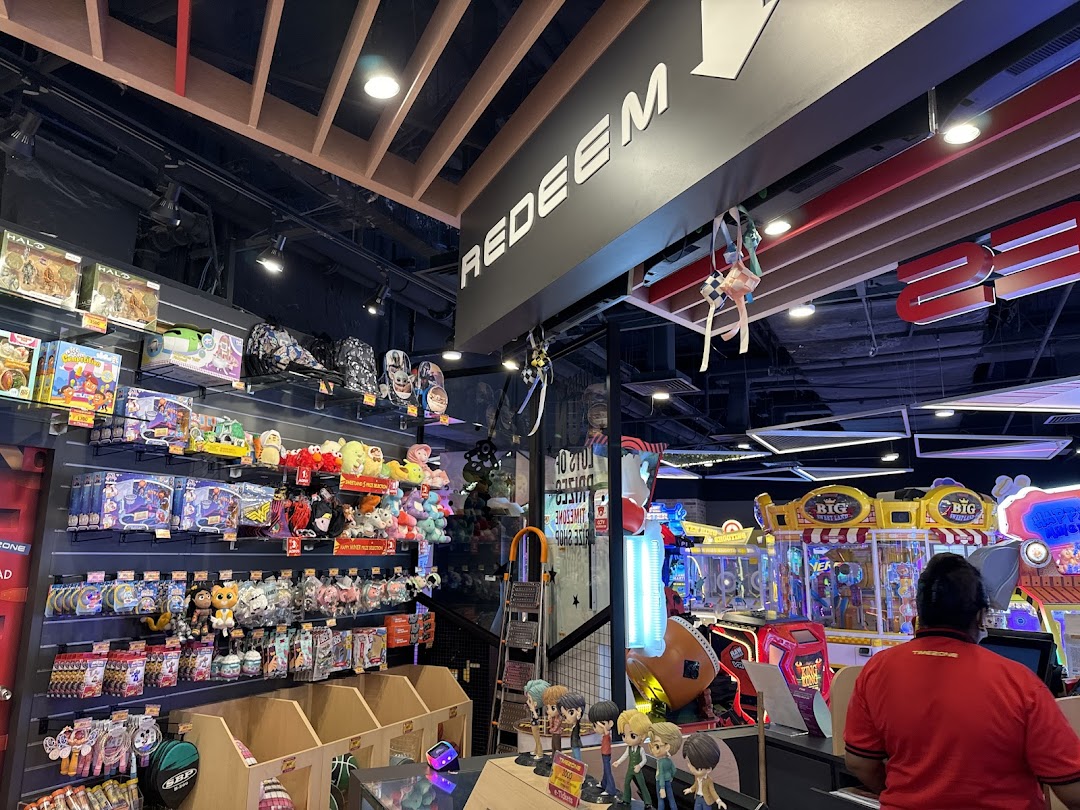 Interior view of Timezone arcade showing the prize redemption counter filled with merchandise and games.