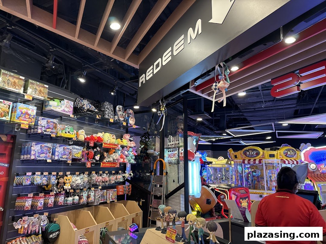 Interior view of Timezone arcade showing the prize redemption counter filled with merchandise and games.