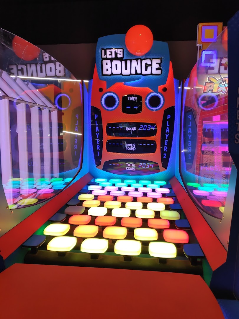 A vibrant 'Let's Bounce' arcade game with colorful illuminated buttons and score display.