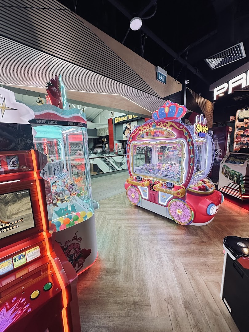 An interior view of Timezone arcade featuring colorful claw machines and other game machines.