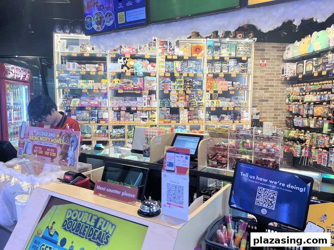 An interior view of Timezone's prize counter area, featuring merchandise displays and promotional signage.