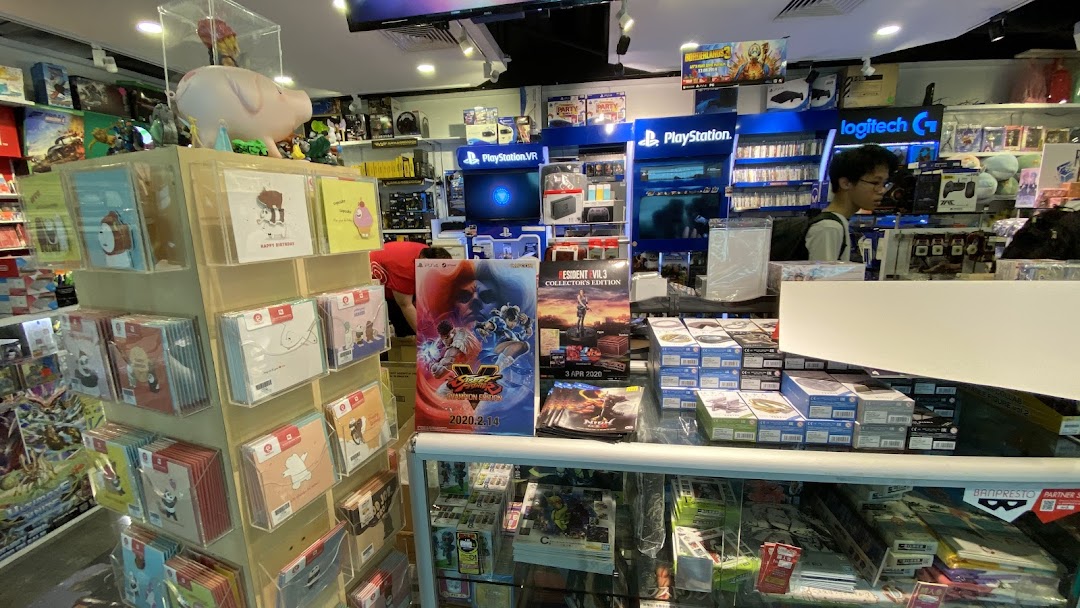 Interior view of a vibrant toy and game shop, featuring PlayStation displays, games, and collectibles.