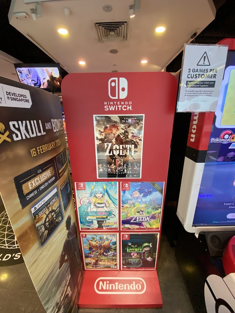 A vibrant Nintendo Switch game display featuring new releases and popular titles inside a game store.