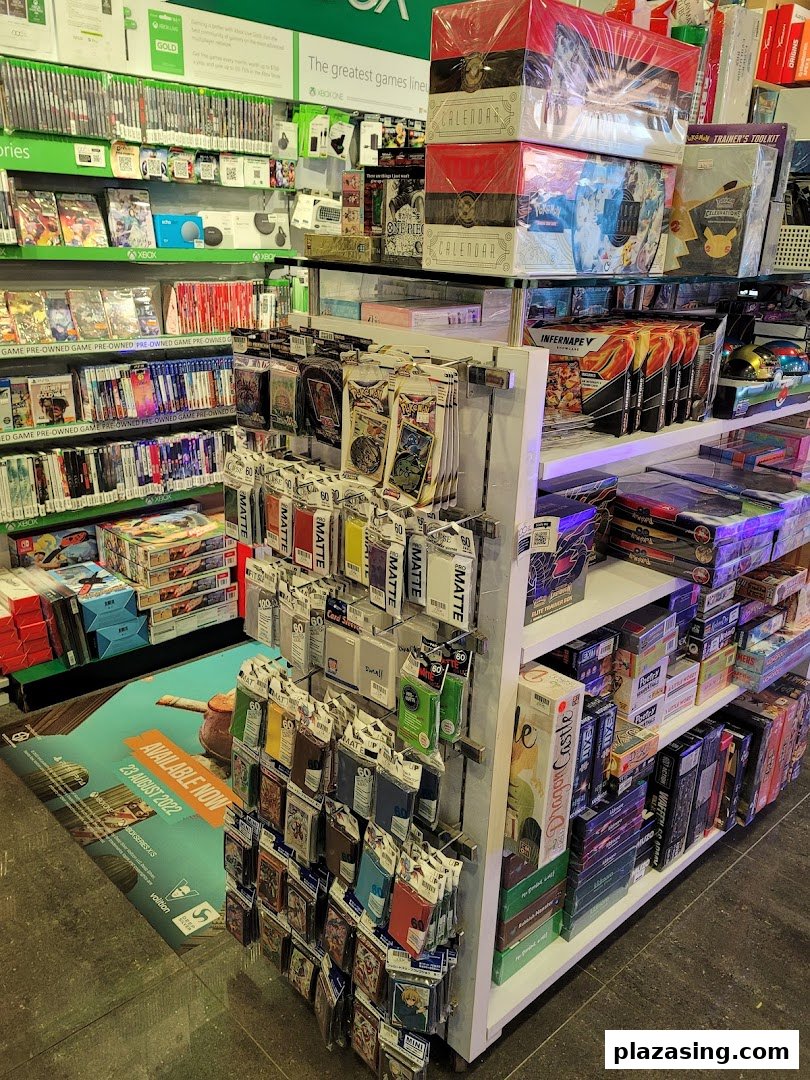 An interior view of TOG - Toy Or Game Plaza Singapura, showcasing shelves packed with video games, board games, and trading card supplies.