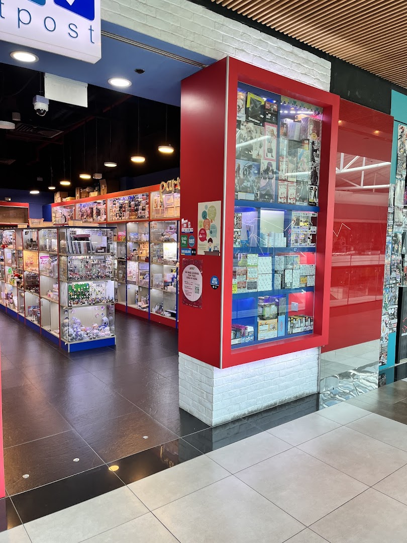 Interior view of Toy Outpost, showcasing numerous display cases filled with diverse toys and collectibles.