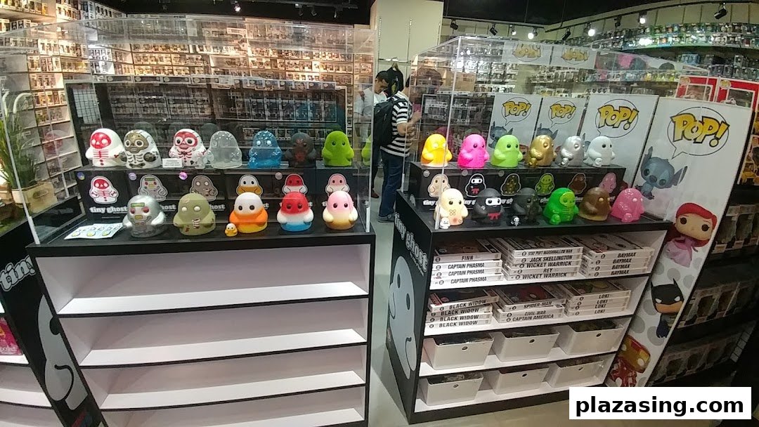 An interior view of Toy Outpost, showcasing colorful collectible figures like Tiny Ghost and Funko Pop! on display shelves.