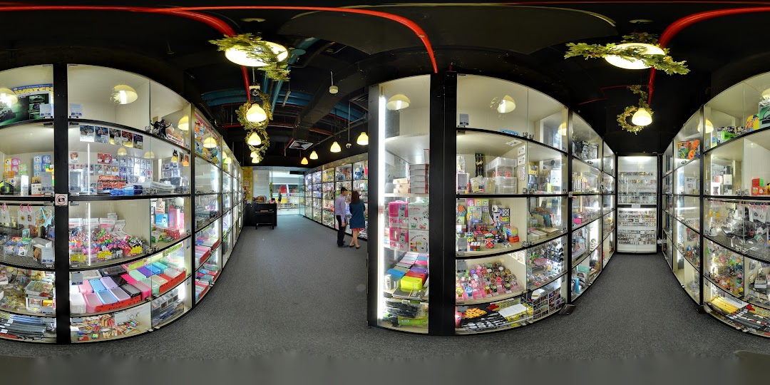 An interior view of Toy Outpost, showcasing numerous display cases filled with a wide variety of toys and collectibles.