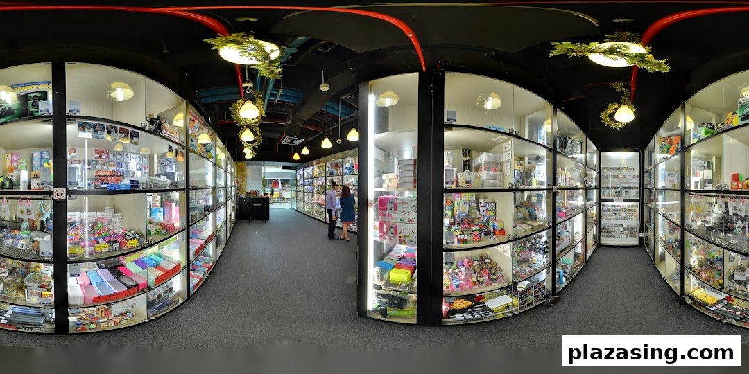 An interior view of Toy Outpost, showcasing numerous display cases filled with a wide variety of toys and collectibles.