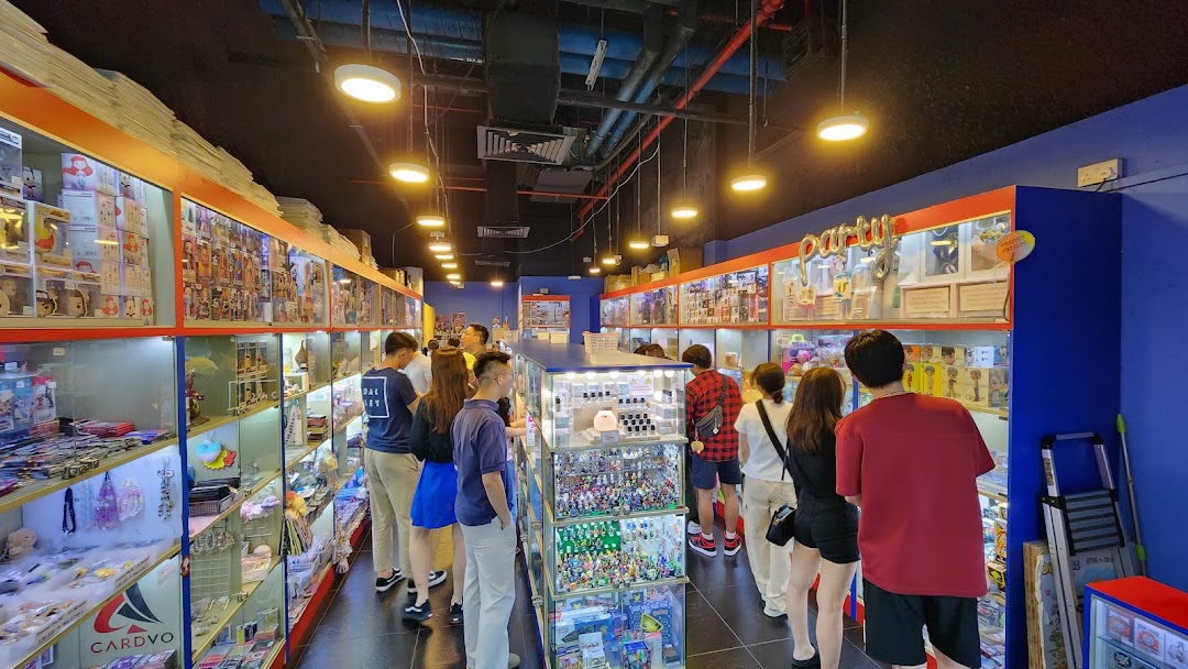 Customers browse a wide array of toys, collectibles, and novelty items displayed in glass cases within a vibrant store.