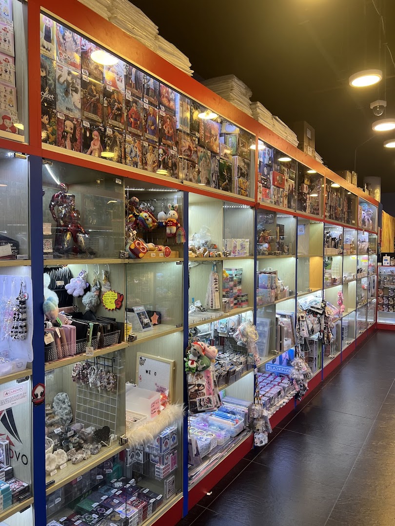 Interior view of Toy Outpost, showcasing numerous display cases filled with diverse toys, collectibles, and accessories.