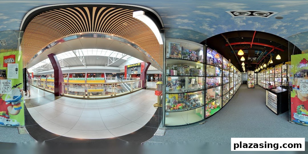 Entrance of Toy Outpost, showcasing display cases filled with collectibles and toys, leading into the mall.