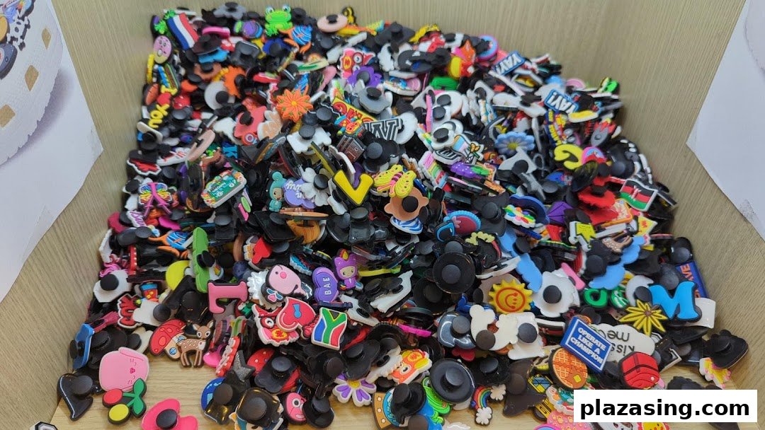 A close-up view of a large bin filled with colorful shoe charms and accessories.