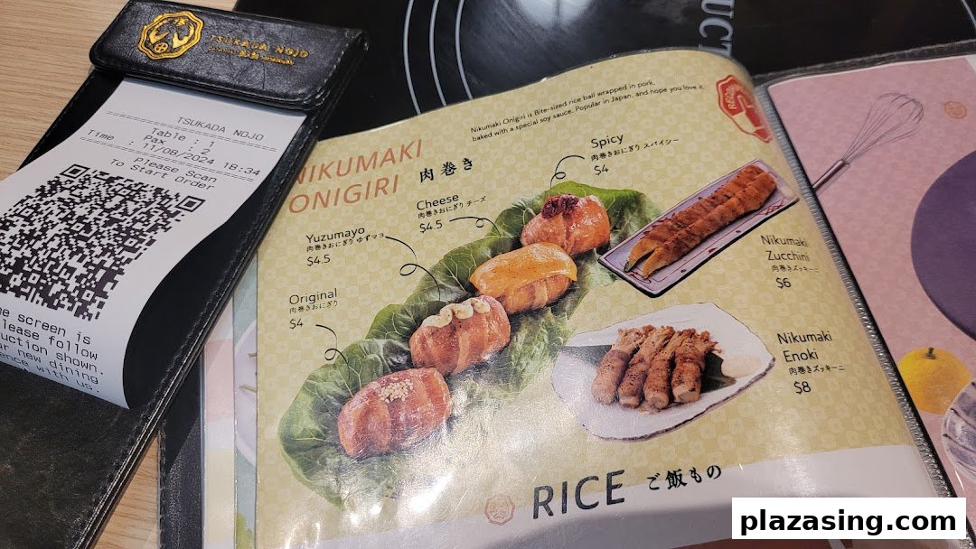 A menu page from Tsukada Nojo showcasing Nikumaki Onigiri and other Nikumaki items, with a QR code for ordering.