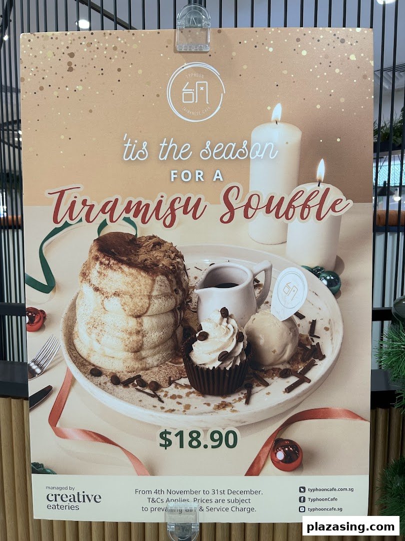 A promotional poster for Typhoon Cafe's Tiramisu Souffle, featuring the dessert, price, and festive decor.