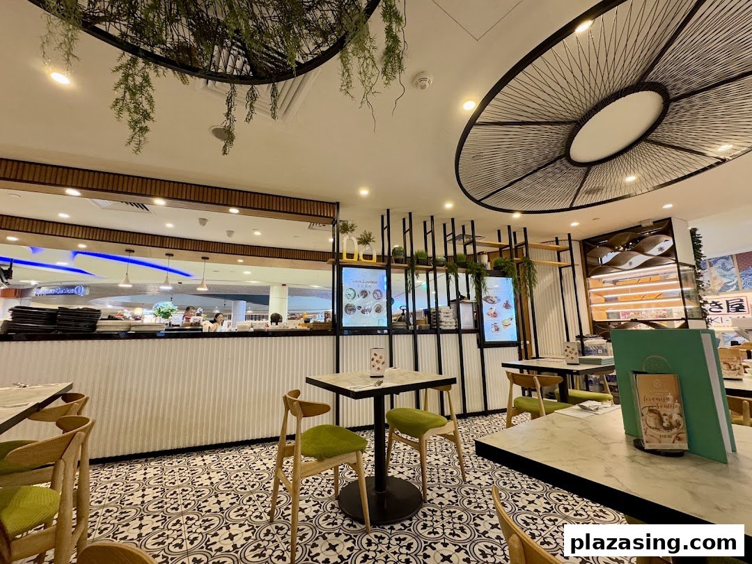 Interior view of Typhoon Cafe, showcasing its stylish decor, patterned floor, and comfortable seating area.
