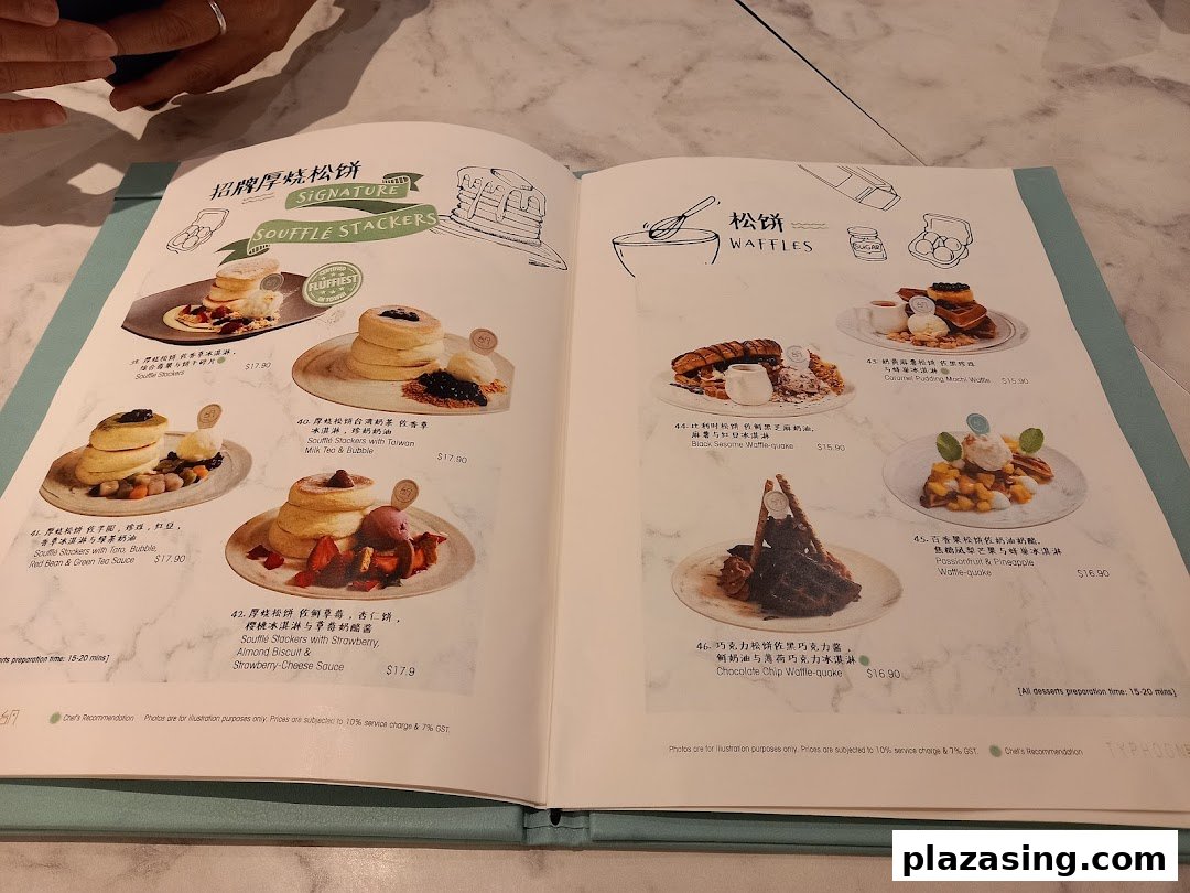 A detailed menu showcasing Soufflé Stackers and Waffles with various toppings and flavors.