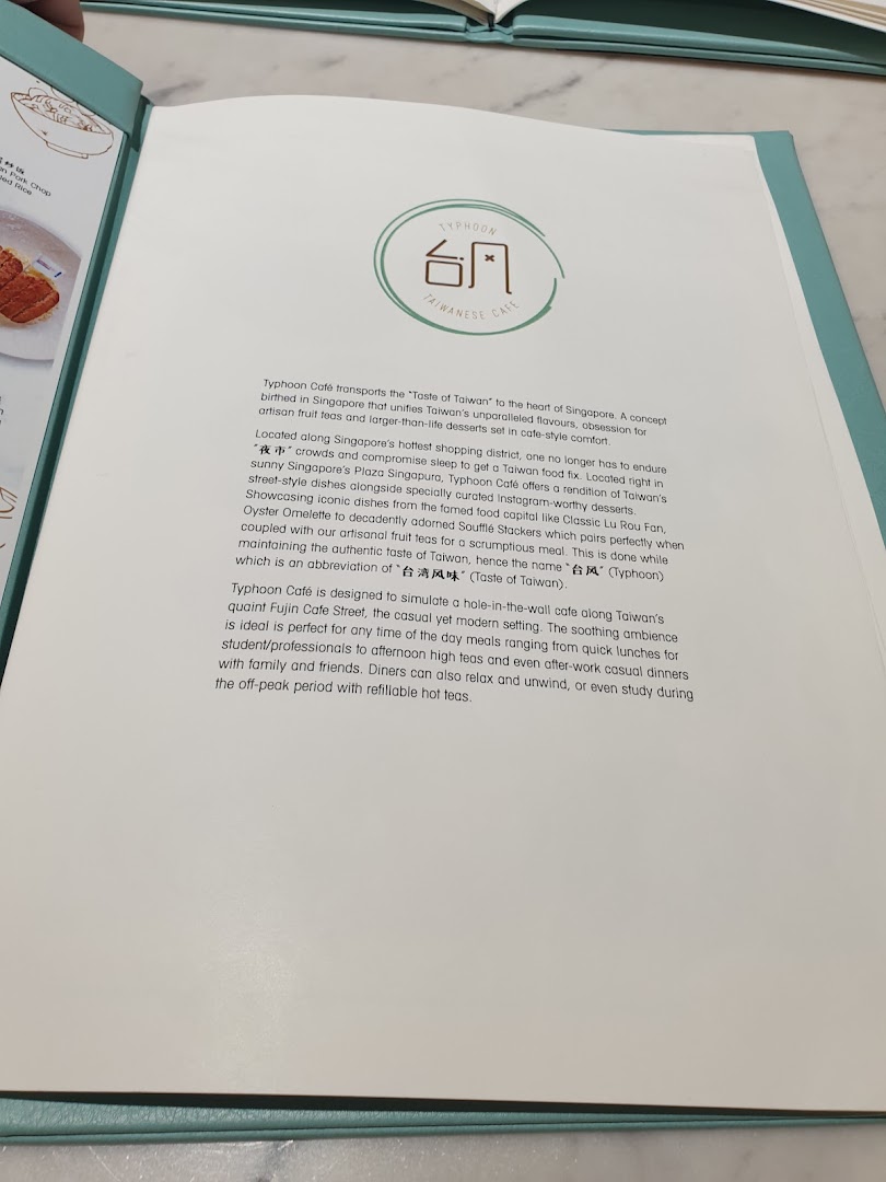 An open menu page displaying the introductory text and logo for Typhoon Cafe.