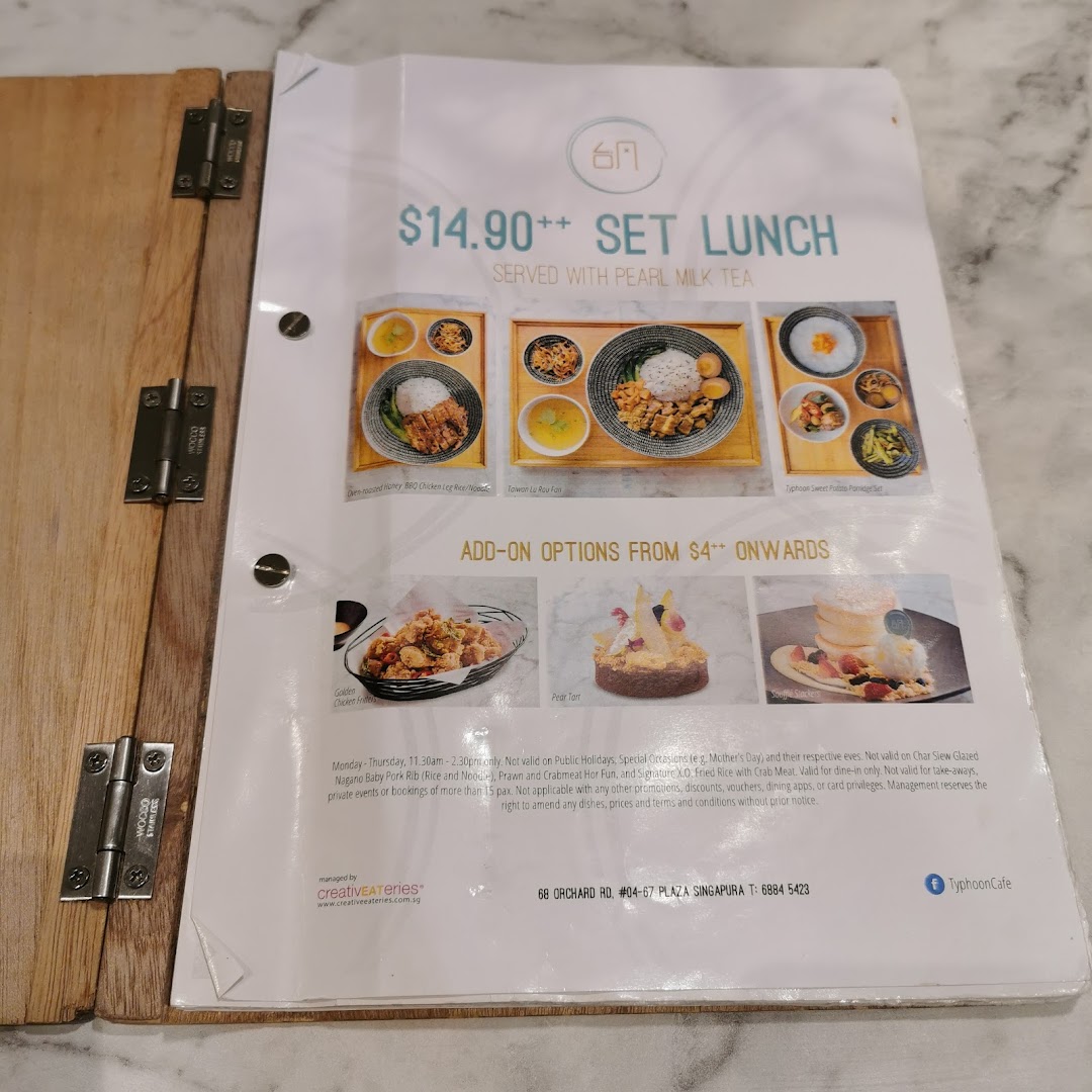 A detailed view of Typhoon Cafe's set lunch menu featuring various dishes and add-on options.