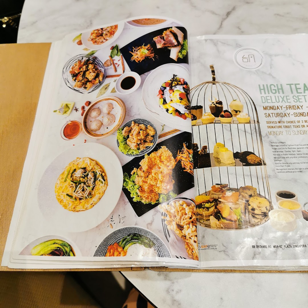 A vibrant menu page showcasing various dishes, including a High Tea Deluxe Set and other Asian delights.