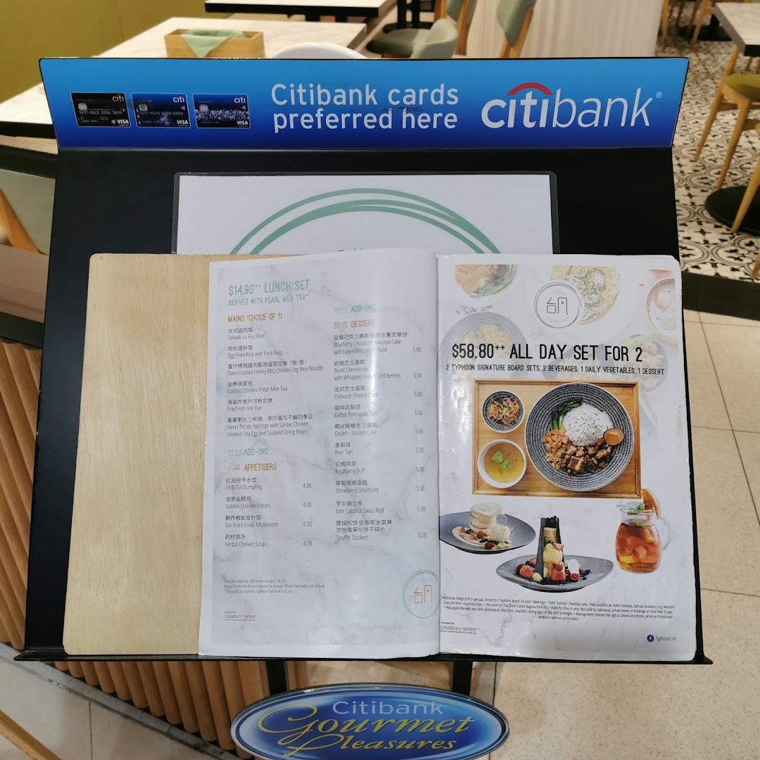 A menu stand displaying lunch sets and all-day dining options with Citibank promotion at Typhoon Cafe.