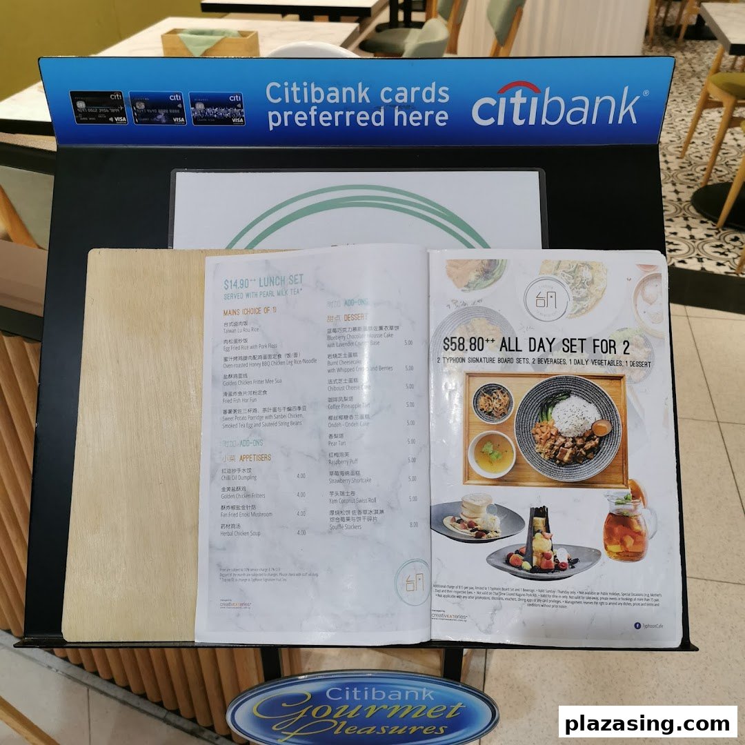 A menu stand displaying lunch sets and all-day dining options with Citibank promotion at Typhoon Cafe.
