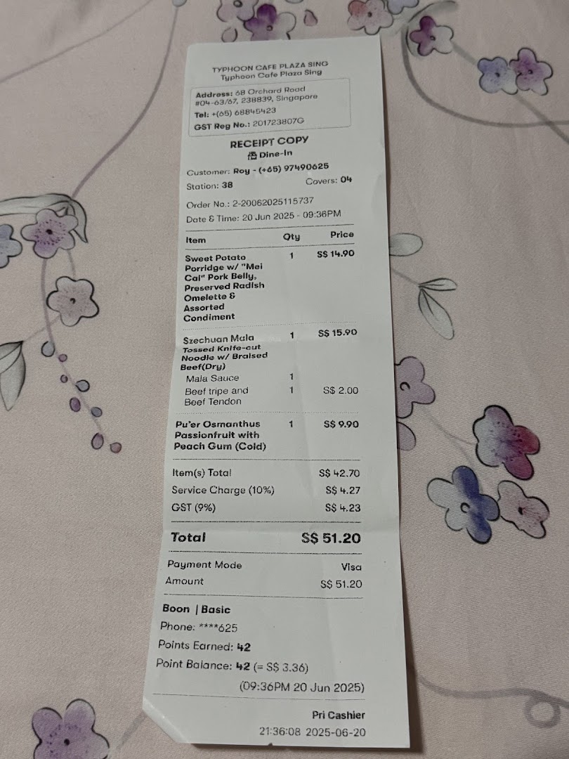 A detailed receipt from Typhoon Cafe Plaza Singapura showcasing purchased food and drink items with prices.