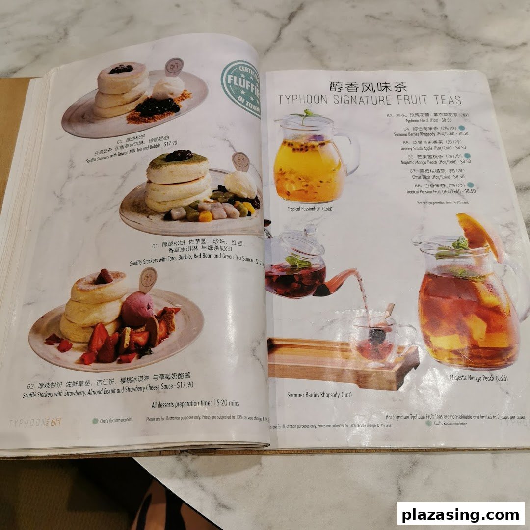 A detailed menu showcasing fluffy soufflé stackers and refreshing signature fruit teas.