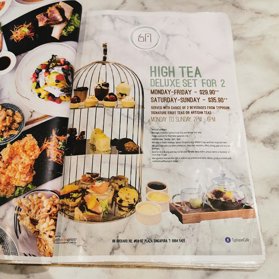 A menu page showcasing Typhoon Cafe's High Tea Deluxe Set for 2 with prices and terms.