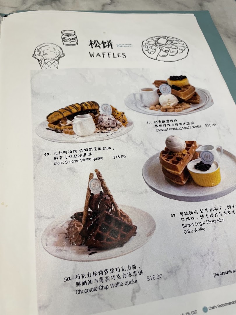 A menu page showcasing various waffle desserts with ice cream and toppings.