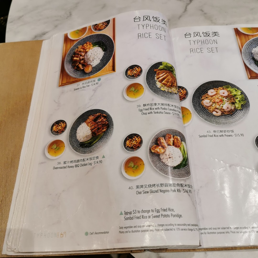 A detailed view of Typhoon Cafe's menu page featuring various rice sets with accompanying dishes.