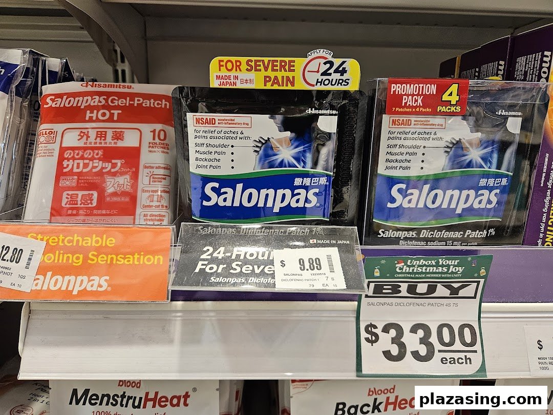 A retail shelf displaying various Salonpas pain relief patches and other heat therapy products.