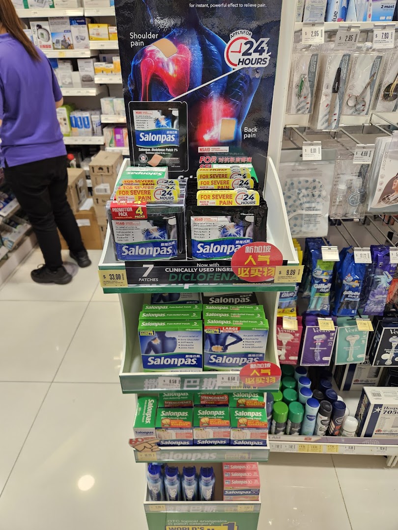 An in-store display featuring various Salonpas pain relief products in a pharmacy or health store.