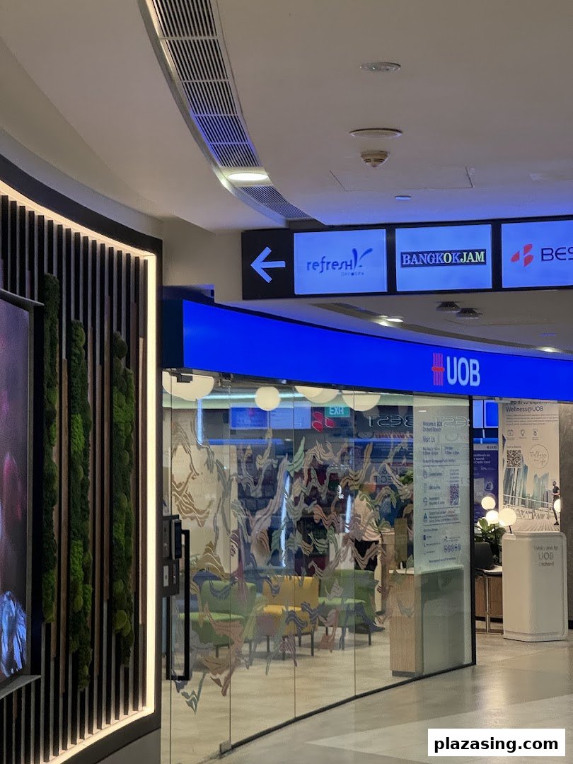 The glass entrance of the UOB Orchard bank branch with interior seating visible.