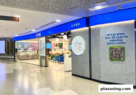 The modern exterior of the UOB Orchard Branch, featuring a welcoming entrance and digital queue system.