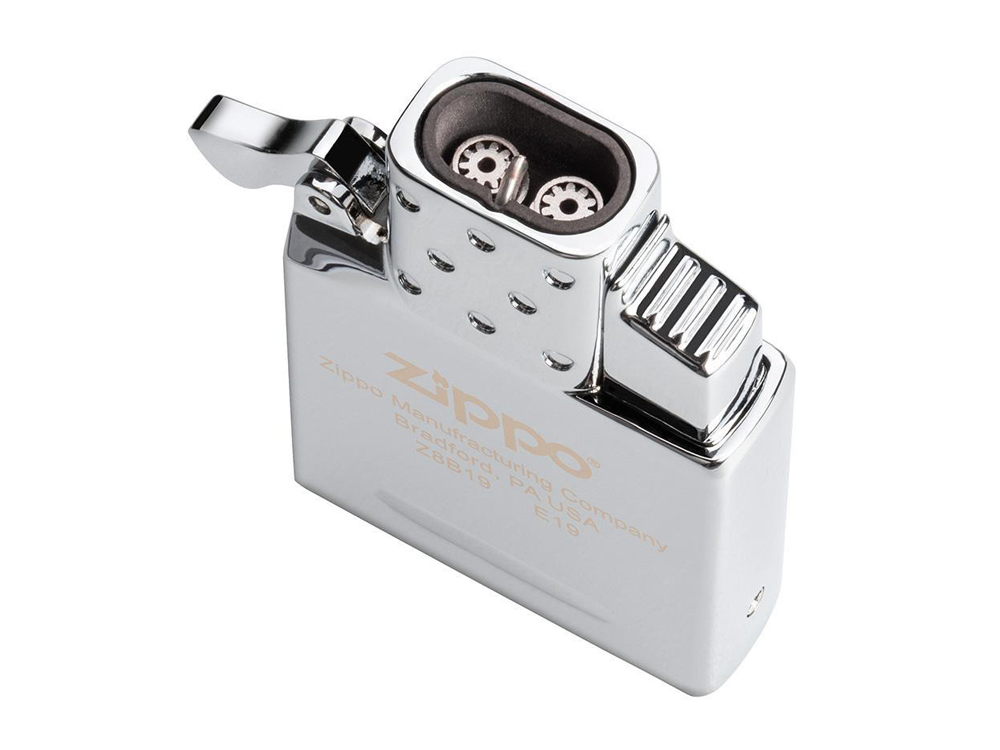 A close-up of a shiny chrome Zippo lighter with its lid open, showcasing its internal mechanism.