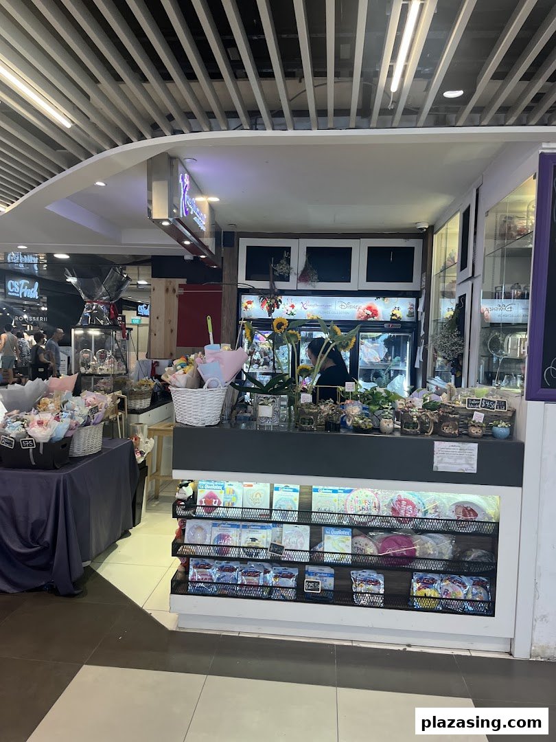 A vibrant Xpressflower kiosk showcasing fresh bouquets, potted plants, and festive balloons.