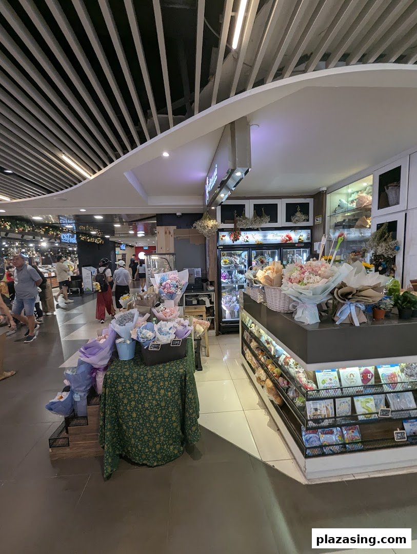 Interior view of Xpressflower, a florist, showcasing colorful bouquets, floral arrangements, and greeting cards.