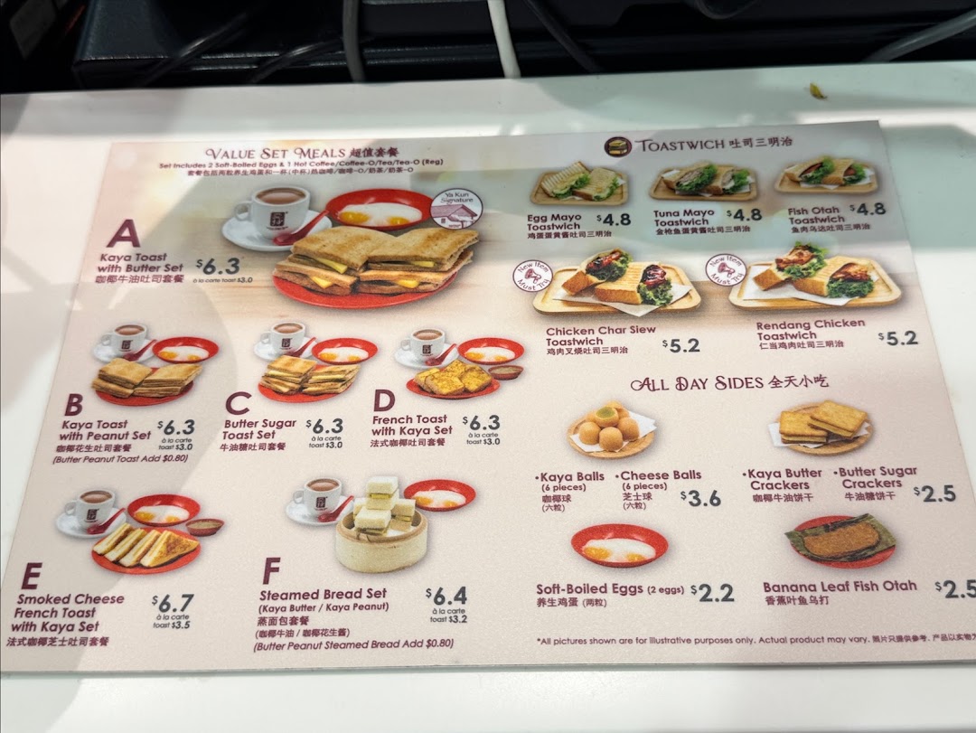 A detailed menu board from Ya Kun Kaya Toast featuring various toast sets, toastwiches, and side dishes.