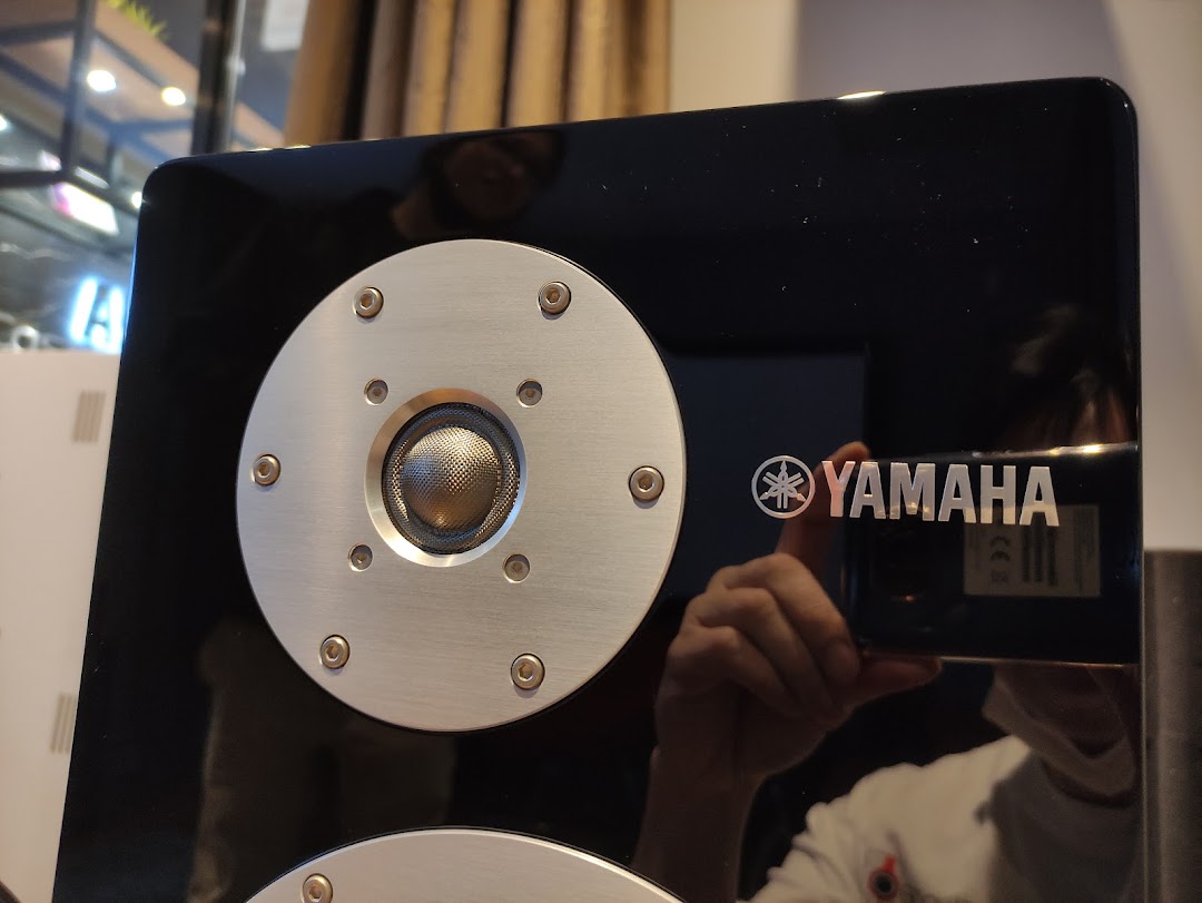 Close-up of a high-fidelity Yamaha speaker with a prominent tweeter and logo.