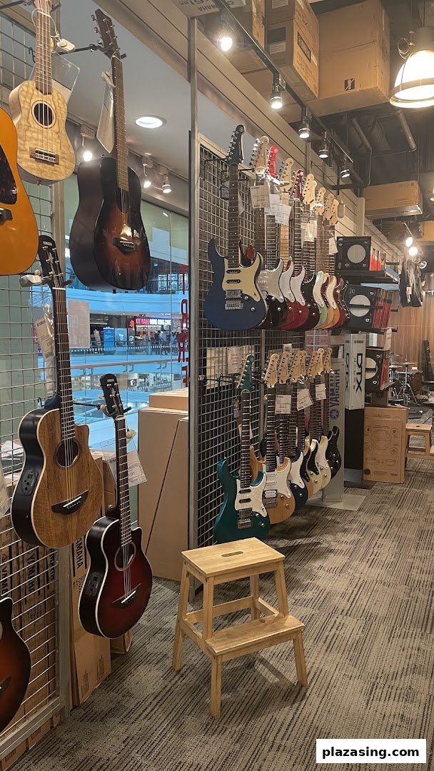Interior view of a Yamaha Music Store showcasing a wide array of acoustic and electric guitars.