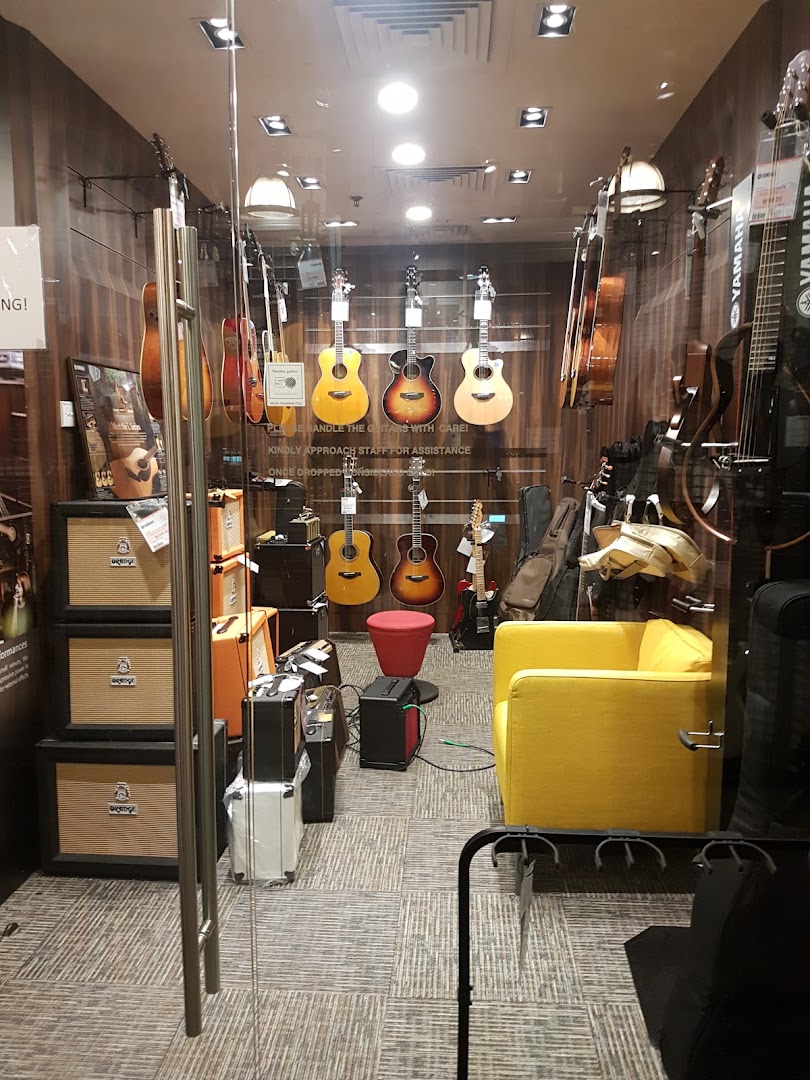 Interior view of Yamaha Music Store showcasing a variety of guitars, amplifiers, and musical instruments.