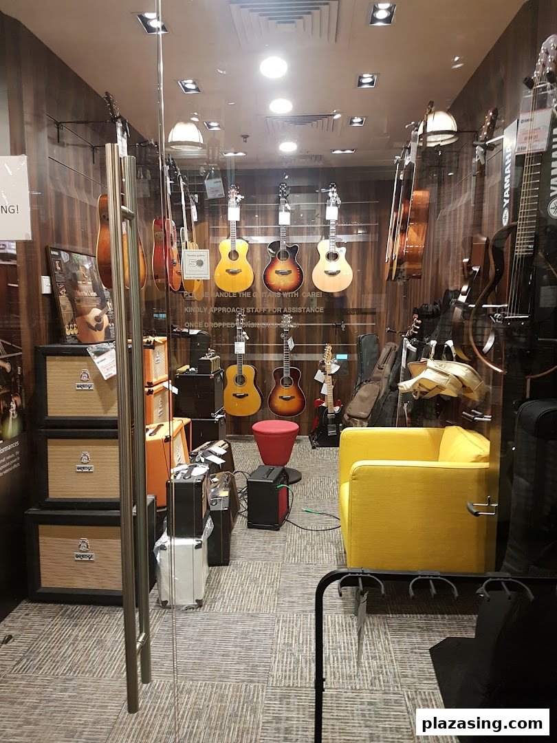 Interior view of Yamaha Music Store showcasing a variety of guitars, amplifiers, and musical instruments.