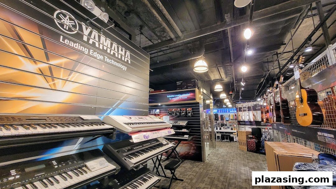 An interior view of the Yamaha Music Store, showcasing various keyboards and guitars.
