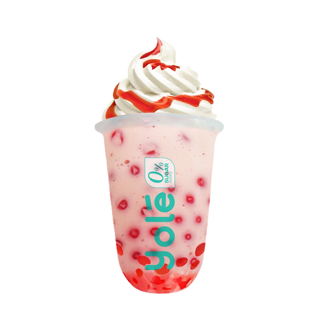 A refreshing Yolé strawberry drink topped with creamy soft serve and strawberry sauce.