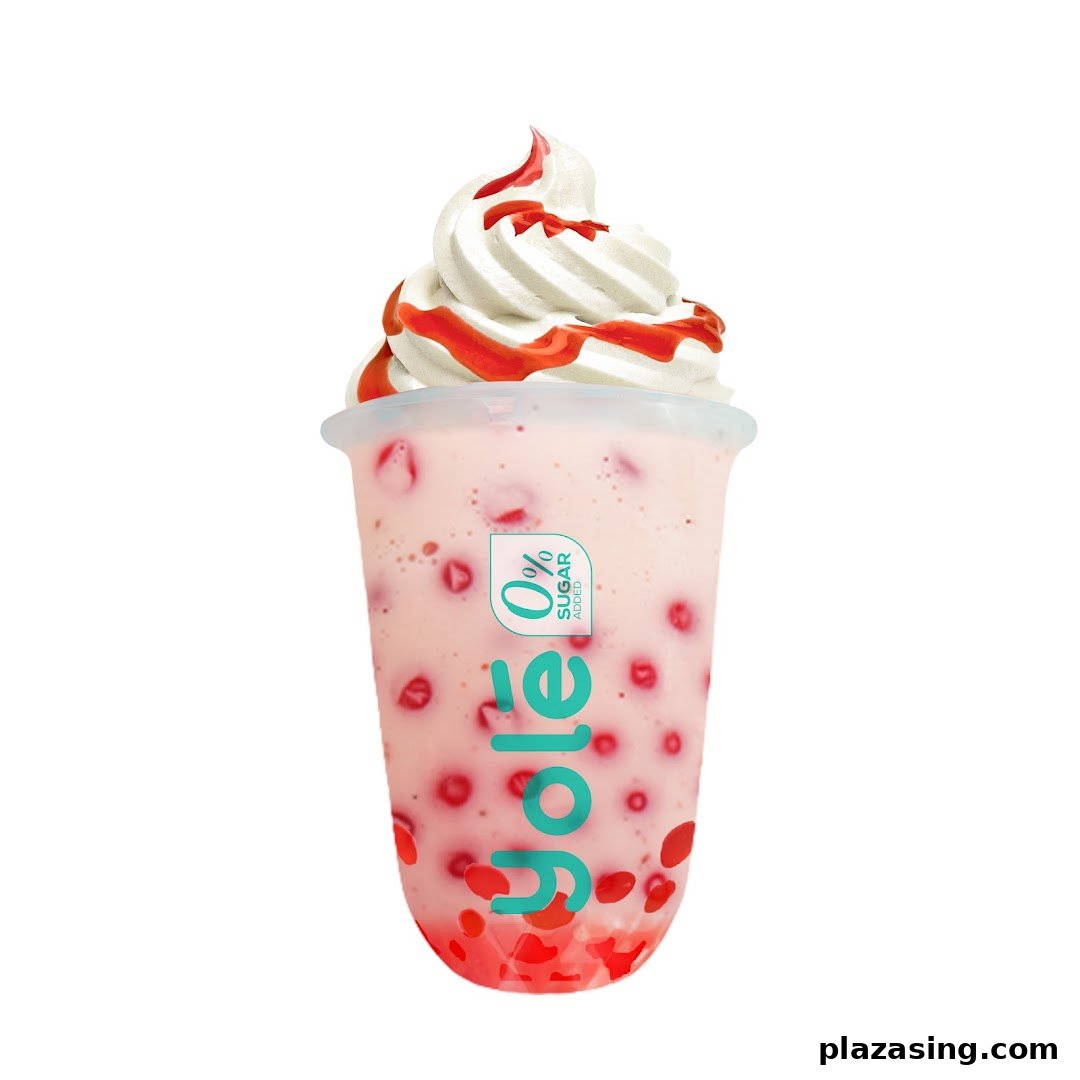 A refreshing Yolé strawberry drink topped with creamy soft serve and strawberry sauce.