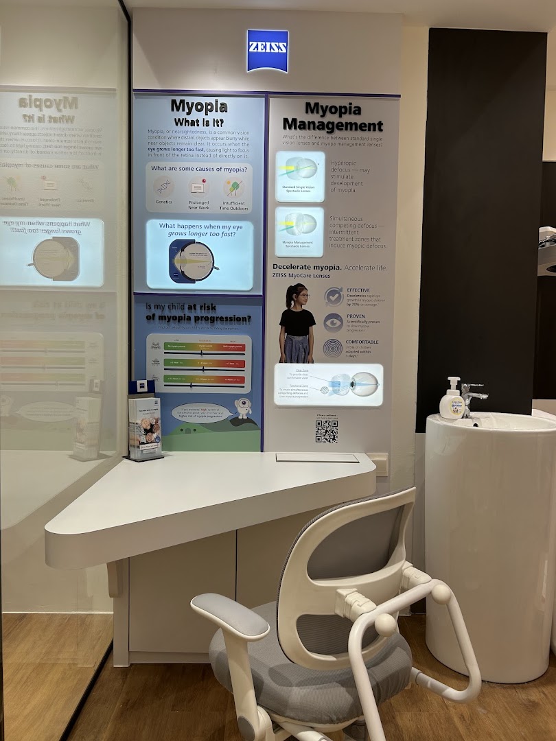 An interior shot of an optometrist's office featuring a detailed ZEISS display on myopia and its management.