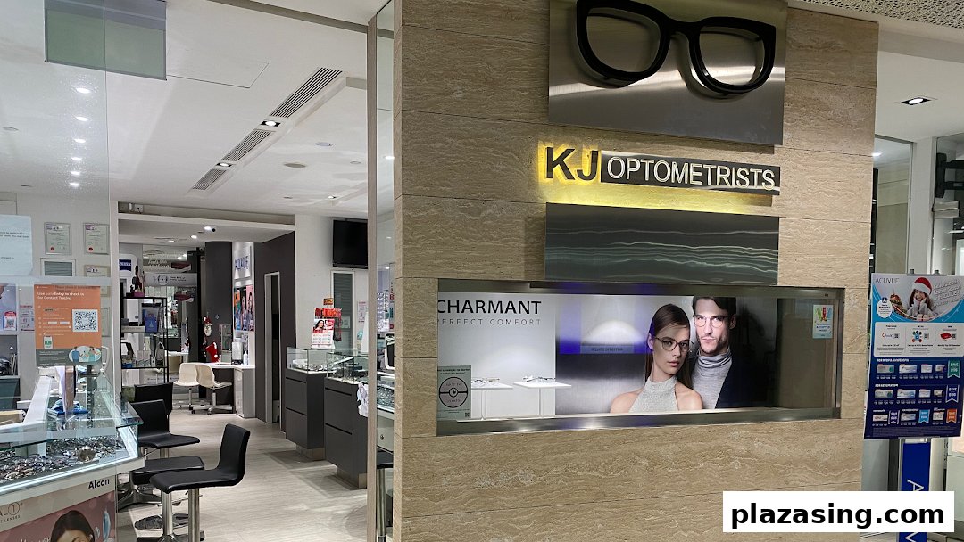 Interior view of KJ Optometrists, showcasing eyewear displays, seating, and professional branding.