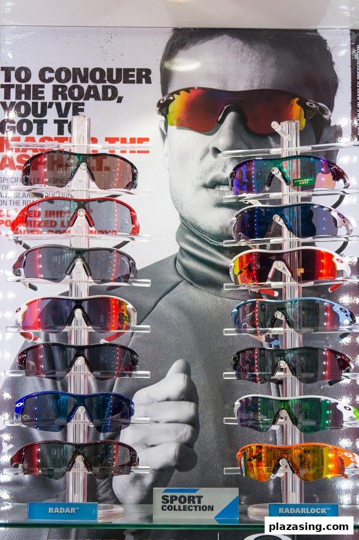 A vibrant display of performance sports sunglasses, featuring various models and lens colors, set against a promotional backdrop.