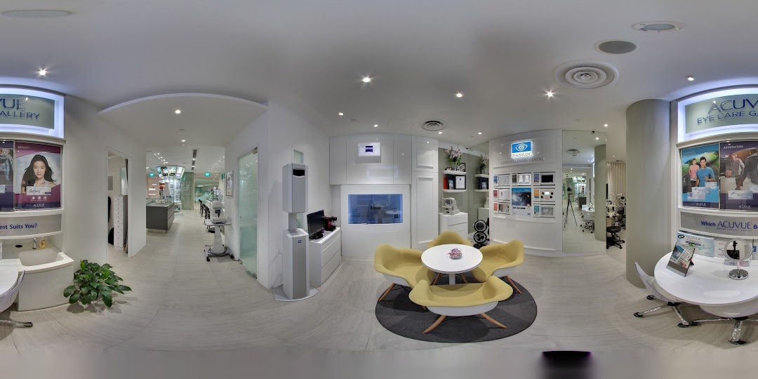A panoramic view of the modern and well-lit interior of ZEISS VISION CENTER, featuring seating, displays, and eye care equipment.
